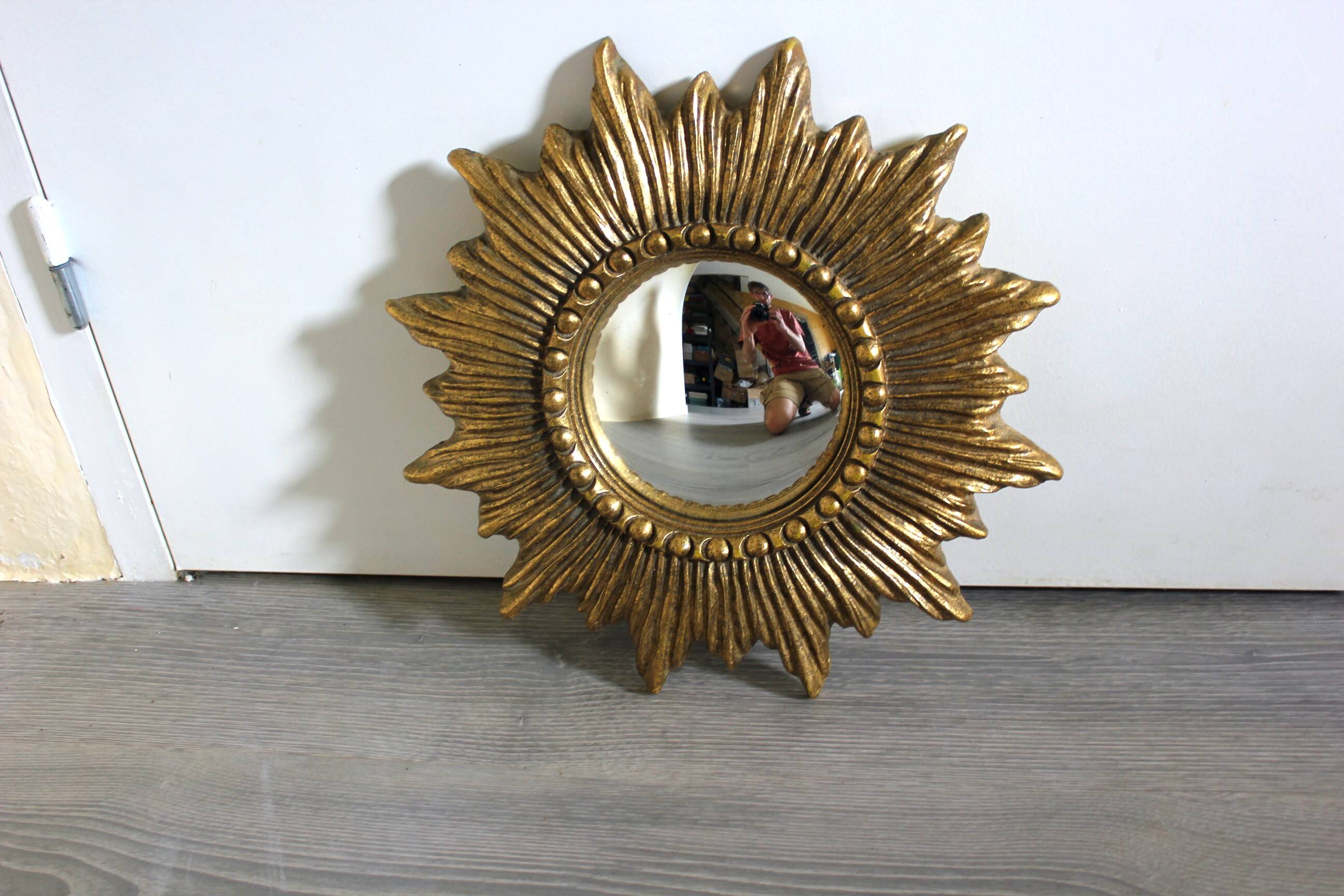 Golden sunburst convex vintage mirror from the 1960s.