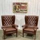 Pair of 1970s Chesterfield wingback chairs in brown leather