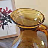 Amber glass pitcher decorated