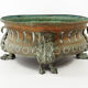 Repelled copper planter with acanthus and cast bronze legs, 1900s