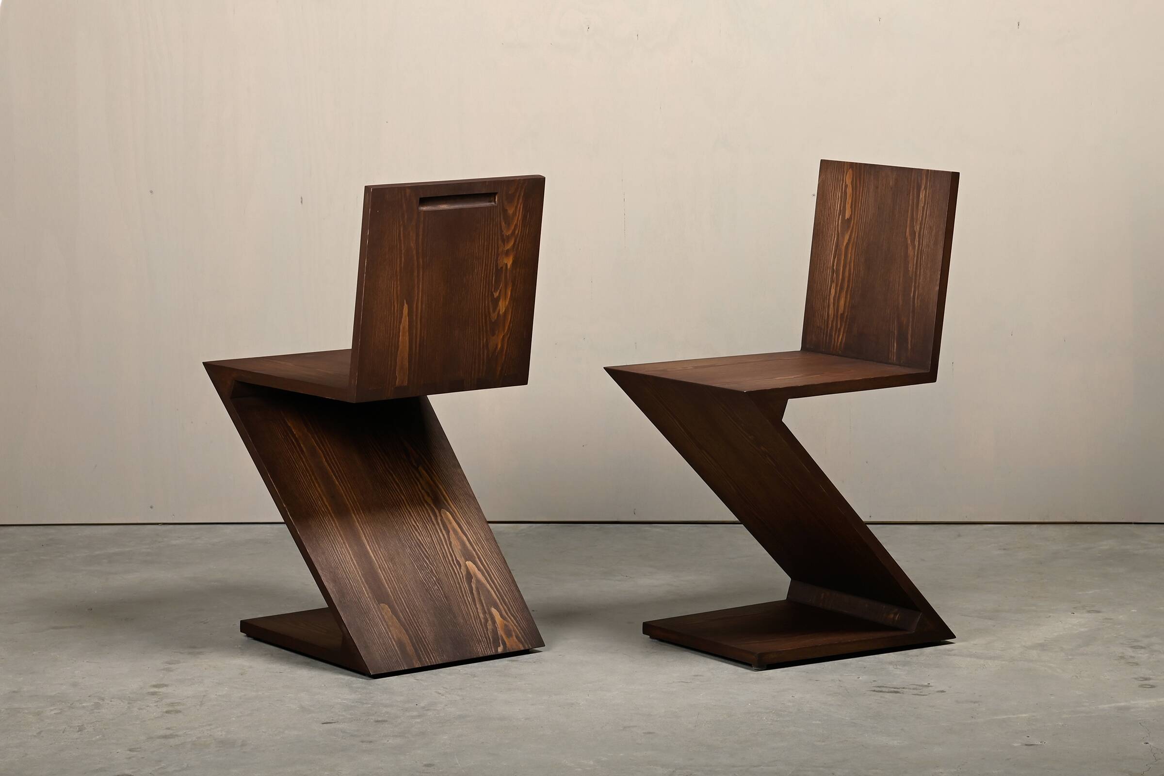 Gerrit Rietveld Zig Zag Chair is dark brown stained wood