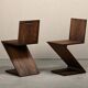 Gerrit Rietveld Zig Zag Chair is dark brown stained wood