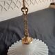 Round pendant light in pleated semi-opaque glass