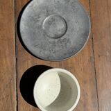 White Indonesian ceramic cup and gray saucer