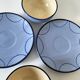 A pair of glazed ceramic cups and saucers from the 60s-70s.