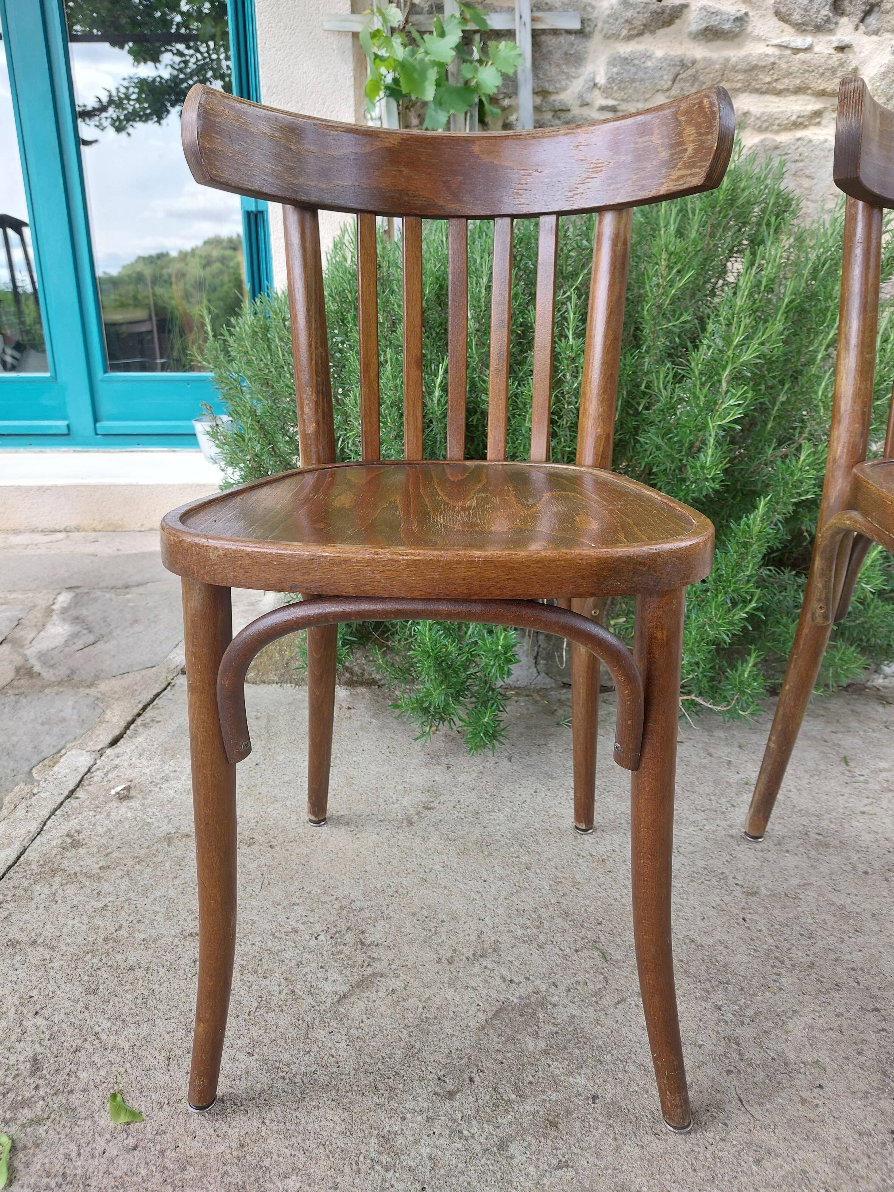 pair of dark bistro chairs, rounded backs, Baumann style