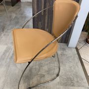 1 Linda armchair chair by Arrben in camel brown leather with a chrome steel frame.