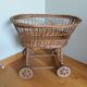 Wicker rattan doll cradle with wheels
