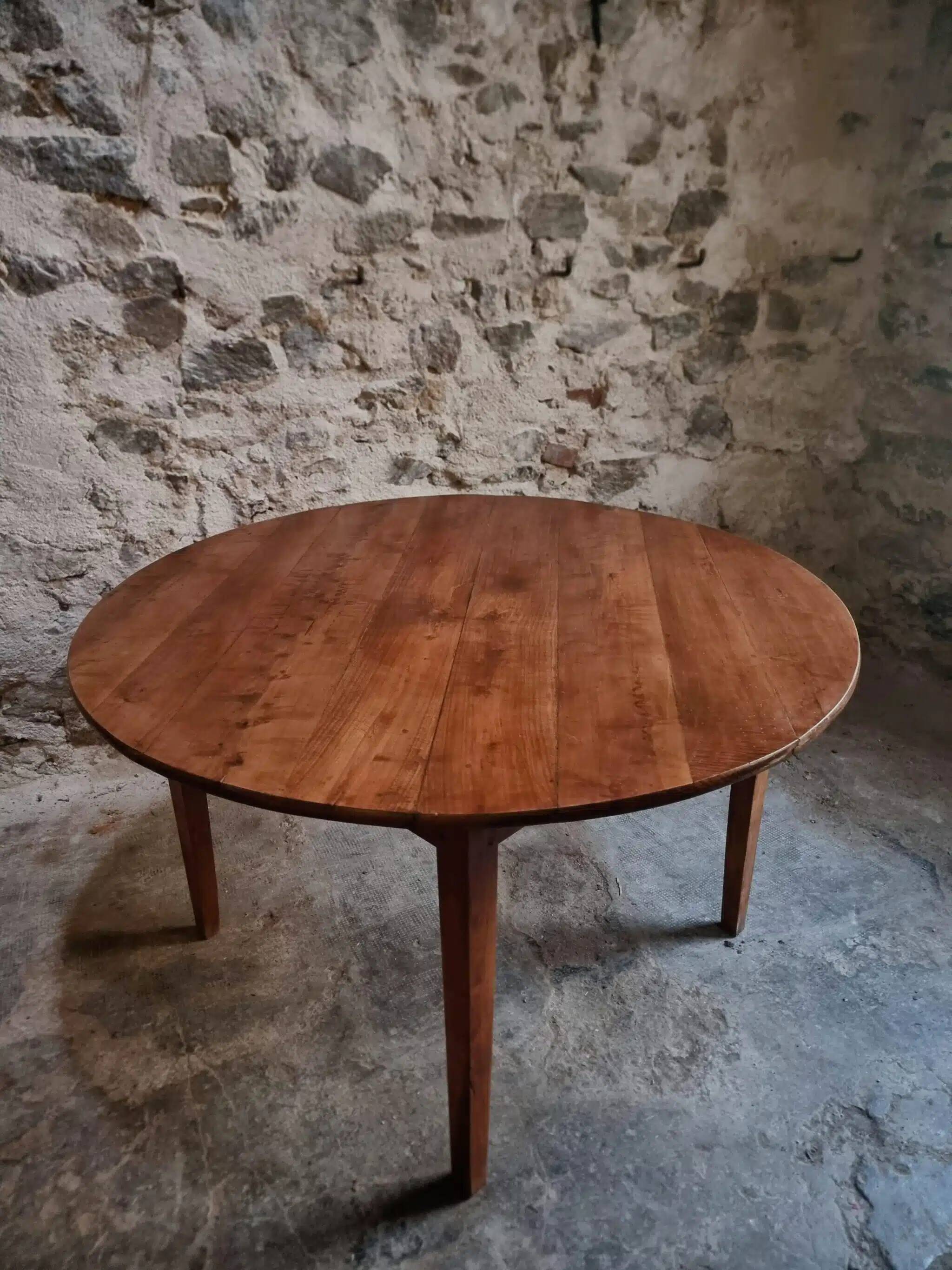 Antique round dining table in cherry wood, France, circa 1920.