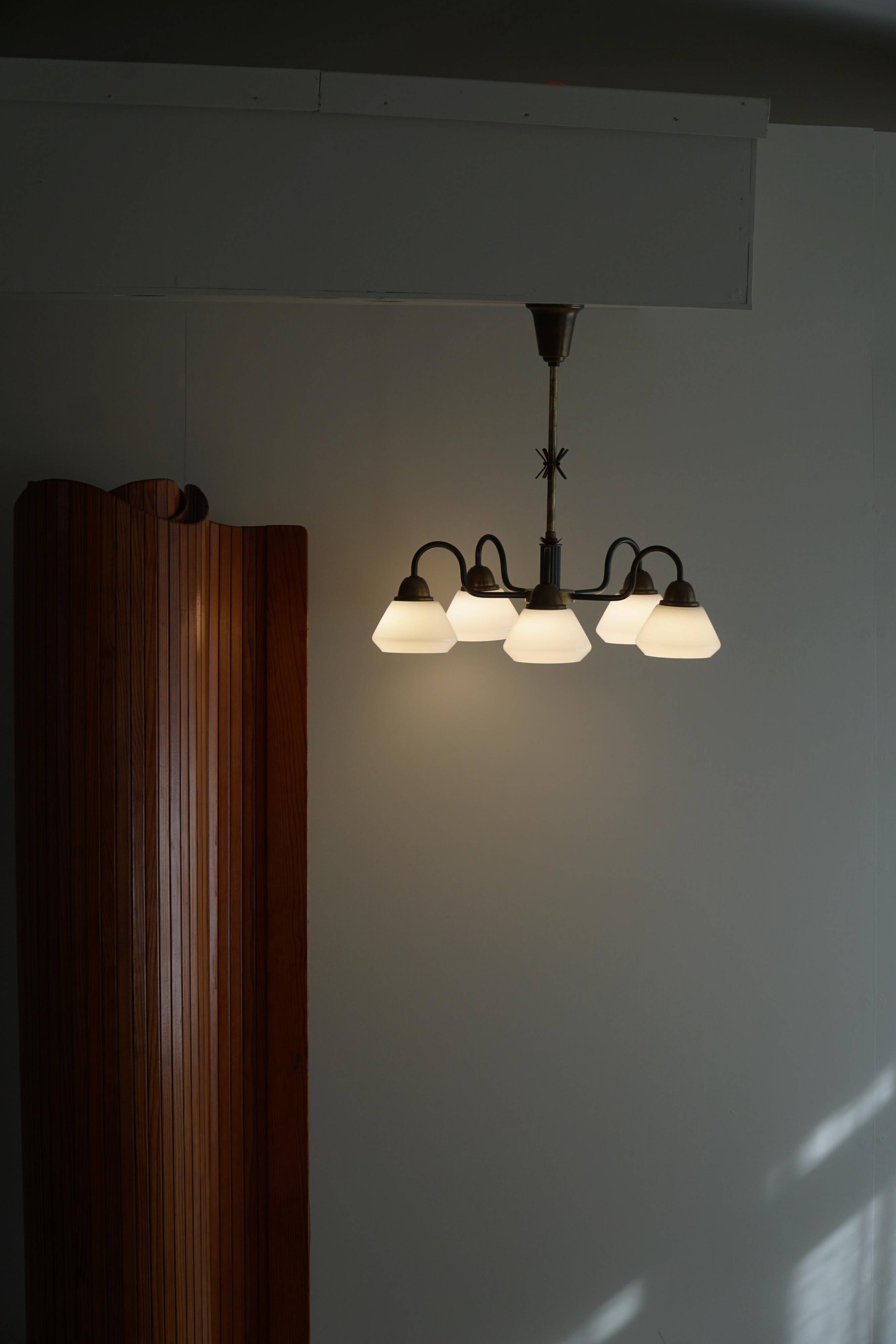 A modern Danish chandelier with 5 heads in opaline glass and brass, Art Deco, 1940s.