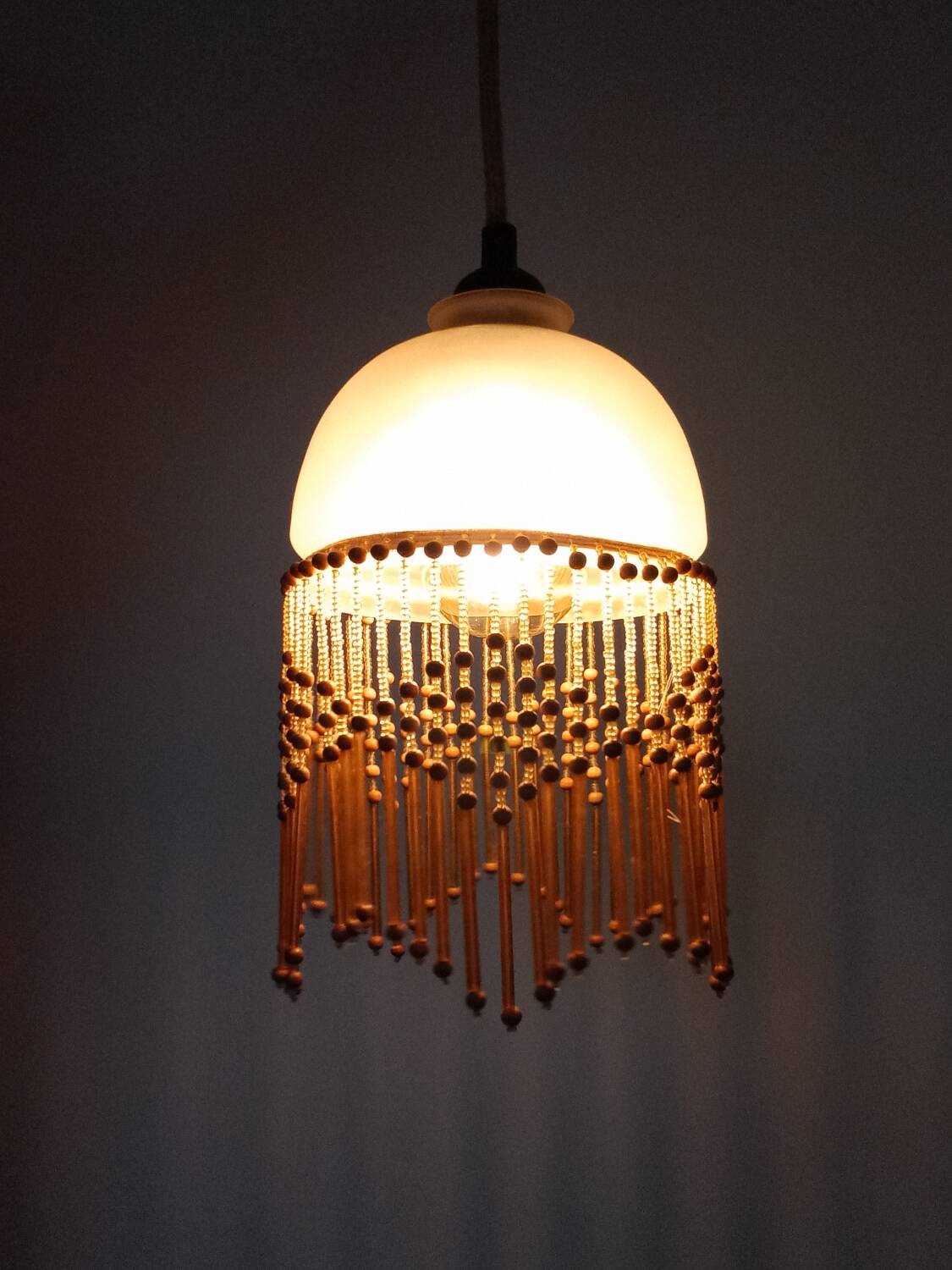 Polished glass and wooden bead pendant light