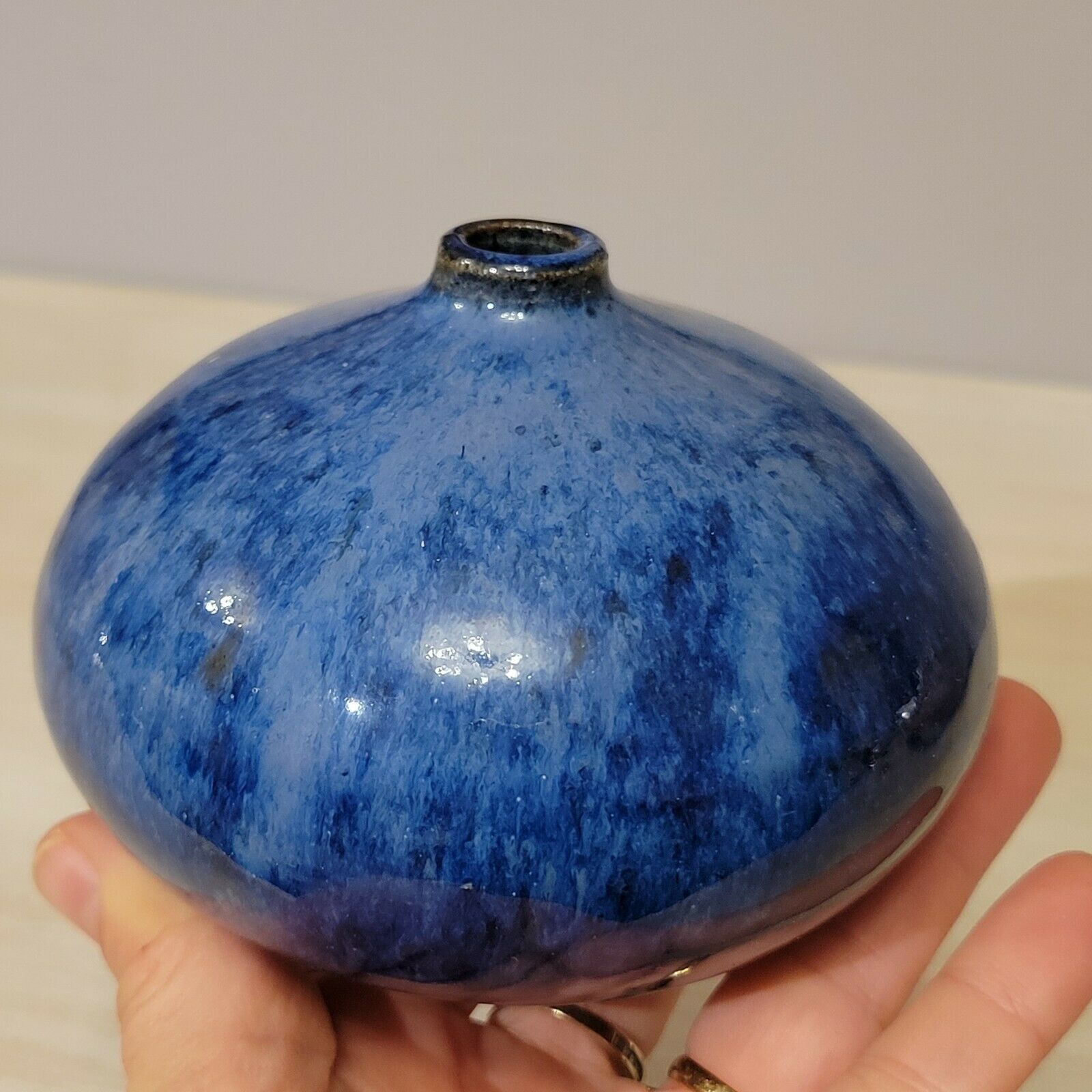 Small blue enamelled ceramic ball vase