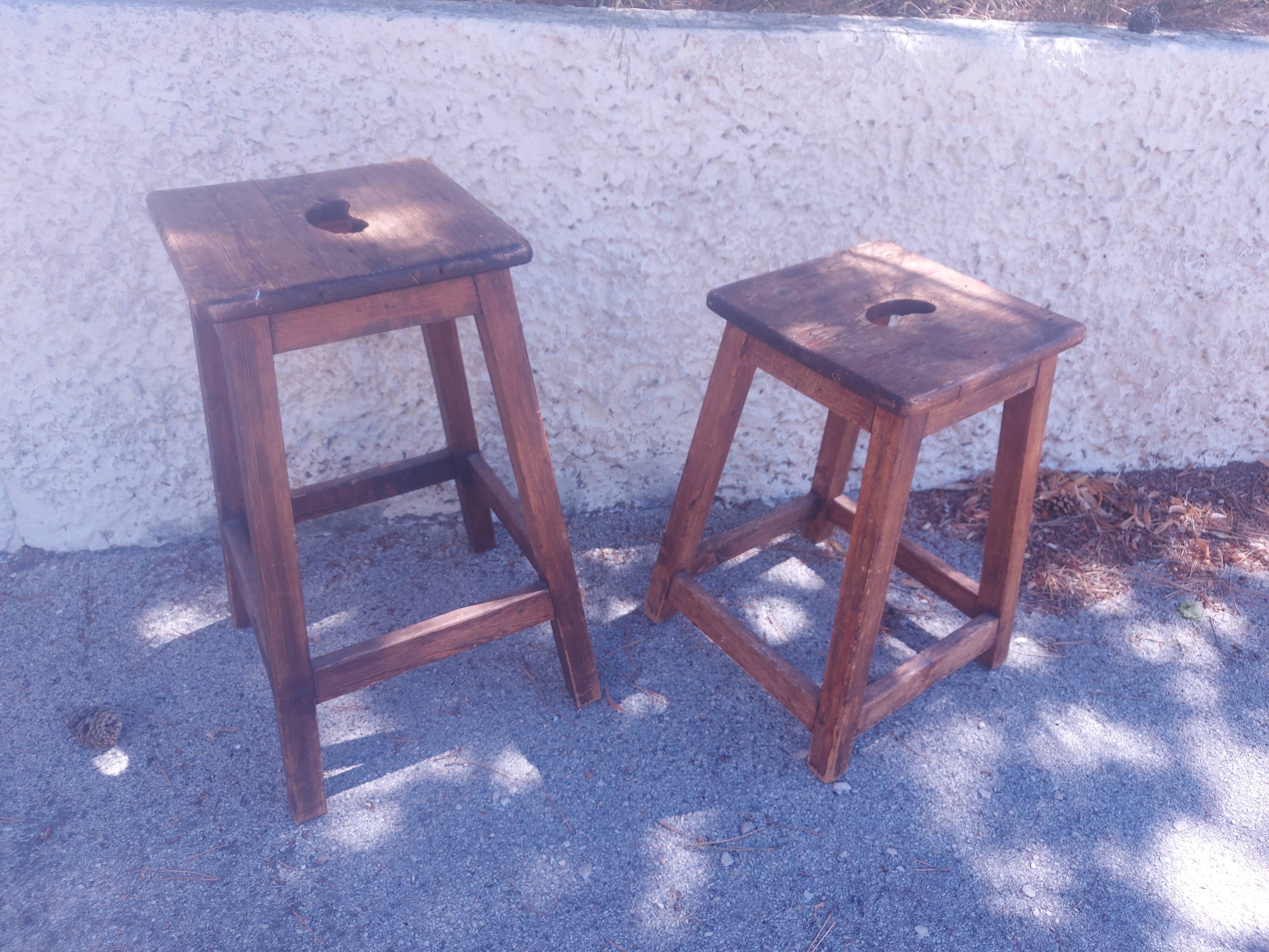 Two vintage wooden stools