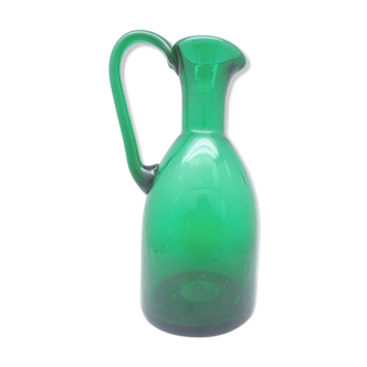 Green pitcher vase made of blown glass