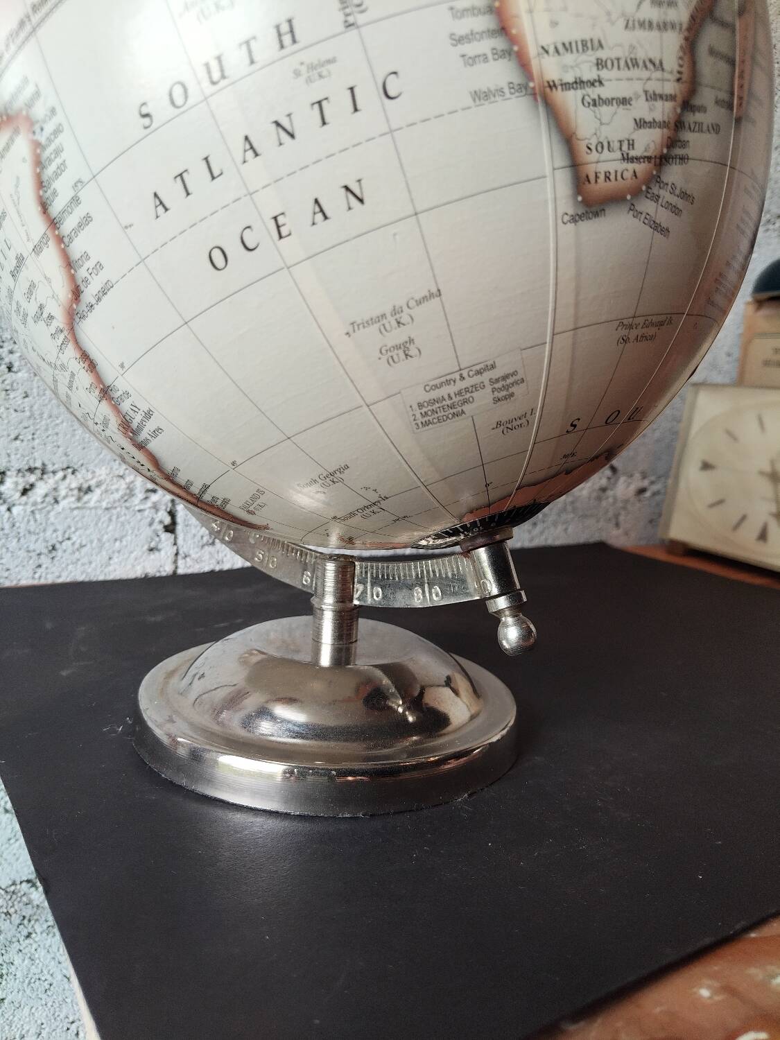 Decorative terrestrial globe on silver metal stand – explorer style