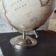 Decorative terrestrial globe on silver metal stand – explorer style