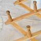 Vintage retractable wall-mounted coat rack made of pine wood
