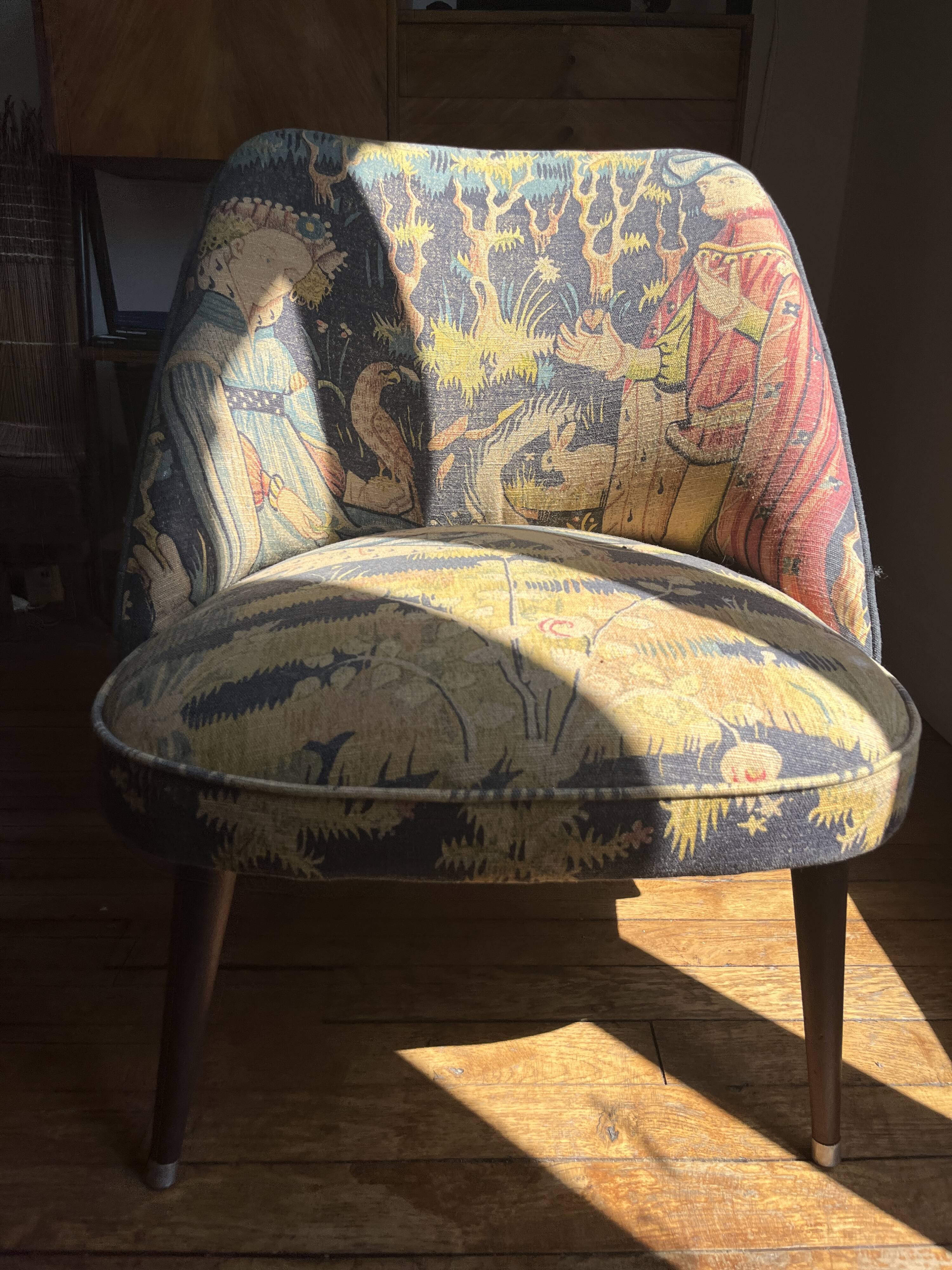 J. Tenreiro, Brazil. Concha armchair with tapered legs, Cluny tapestry 1400.
