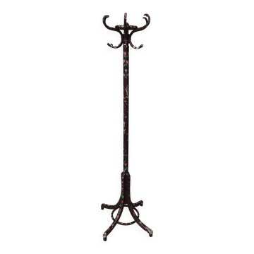 Wooden parrot coat rack with painted floral decoration.