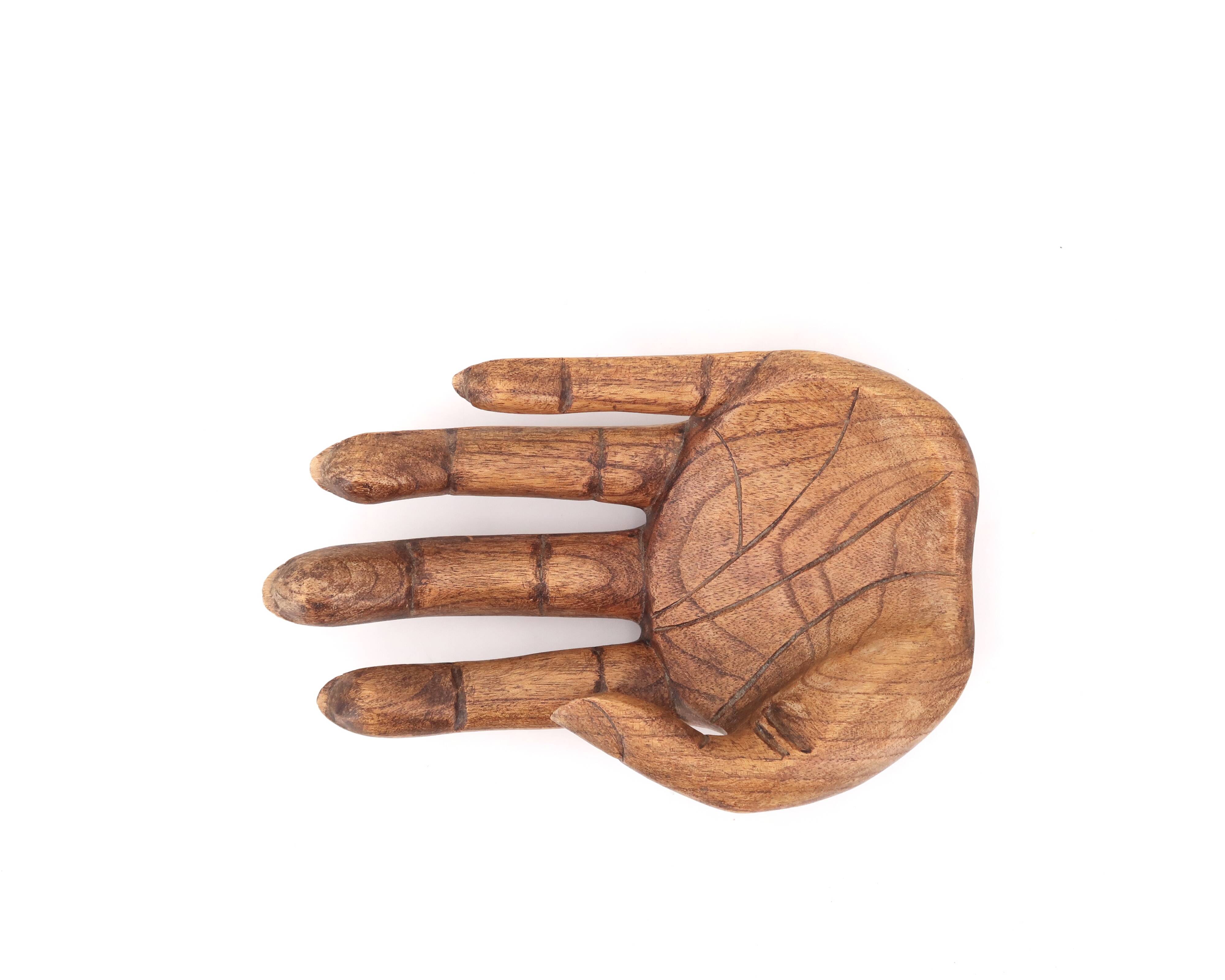 Empty wooden pocket in the shape of a hand, vintage