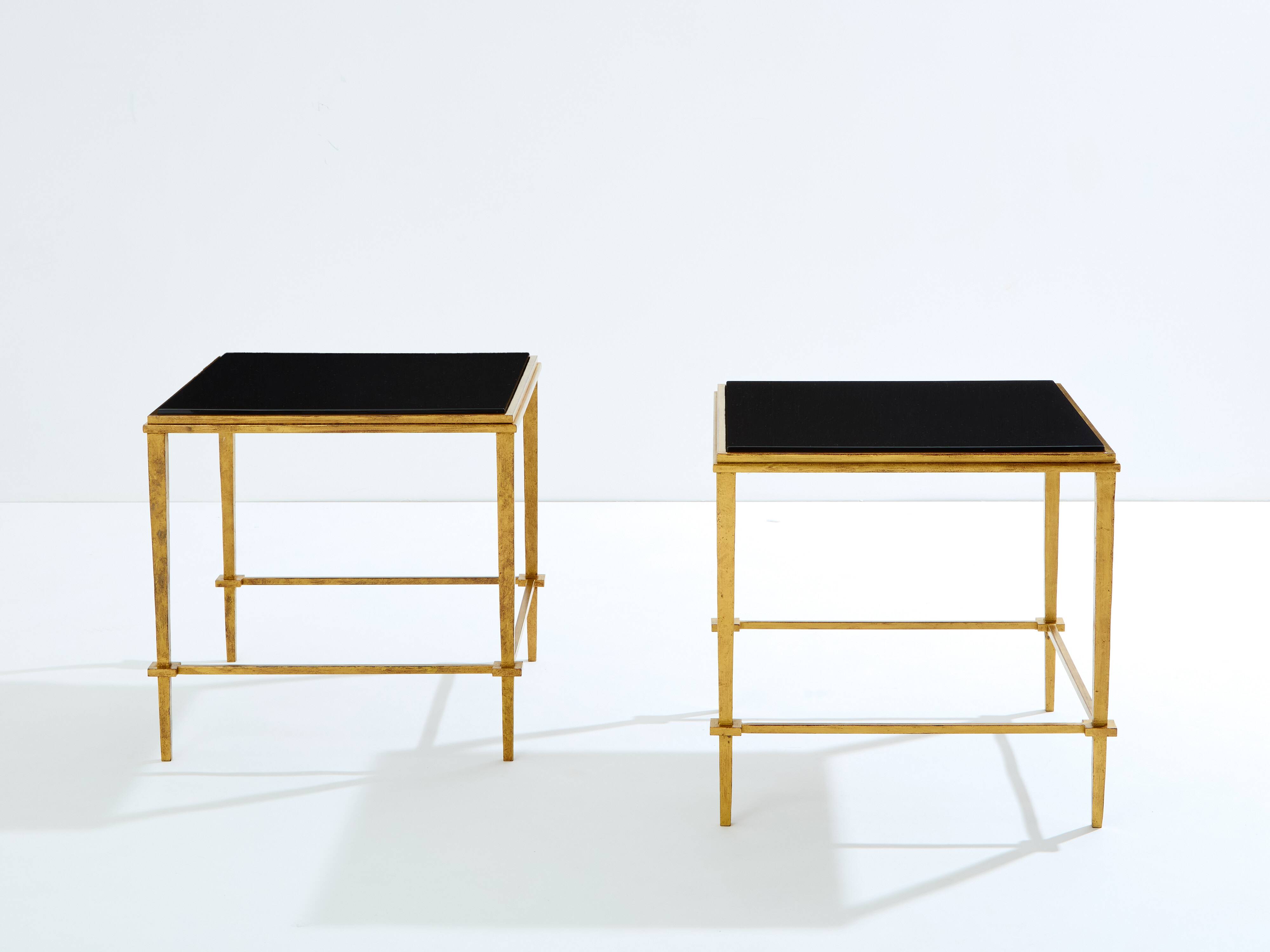 Pair of side tables in gilded iron and black lacquer Maison Ramsay 1950