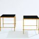 Paire de tables d’appoint fer doré laque noire Maison Ramsay 1950