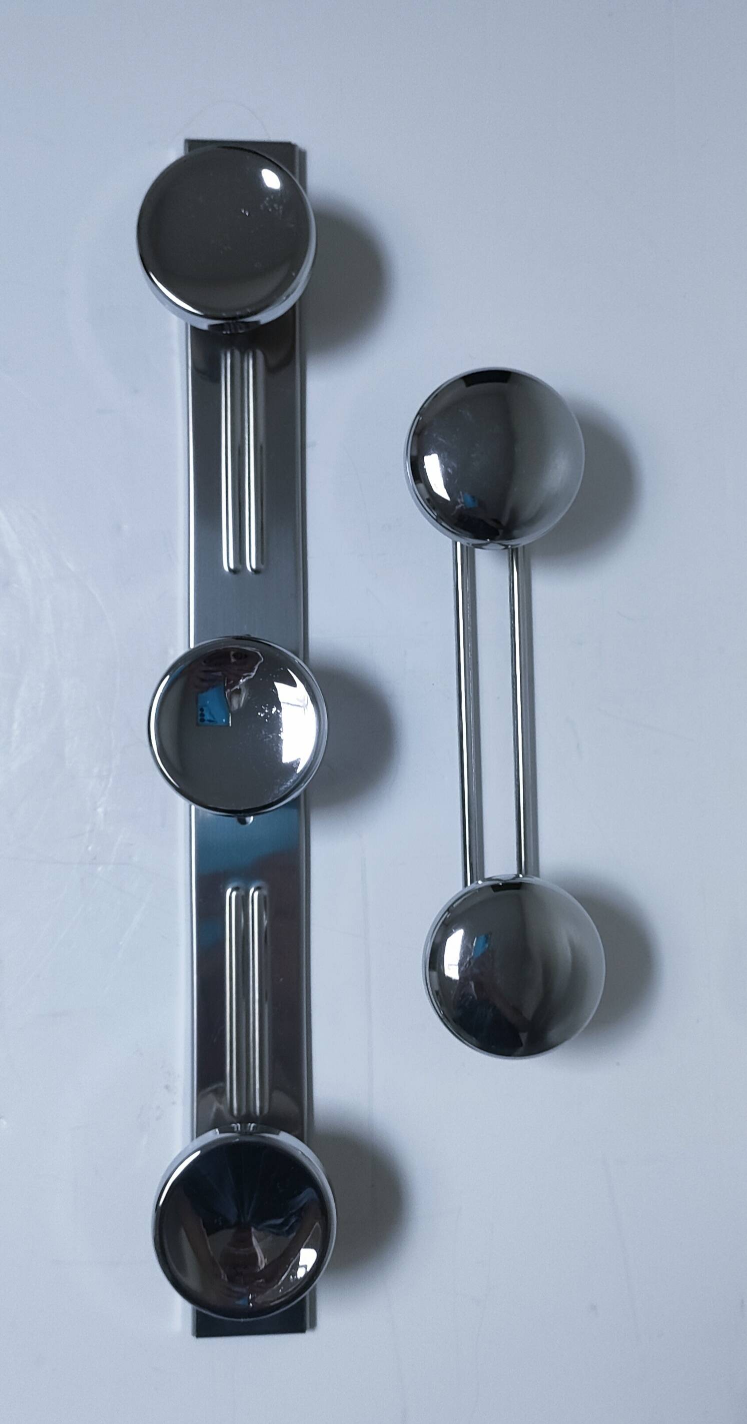 two vintage chrome metal coat hooks