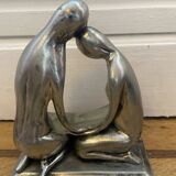 Tin figurine of a couple in love