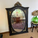 Large old trumeau mirror in black and gilded wood Napoleon style