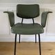 Vintage chair with green imitation leather armrests