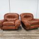2 fauteuils en cuir cognac, années 1970