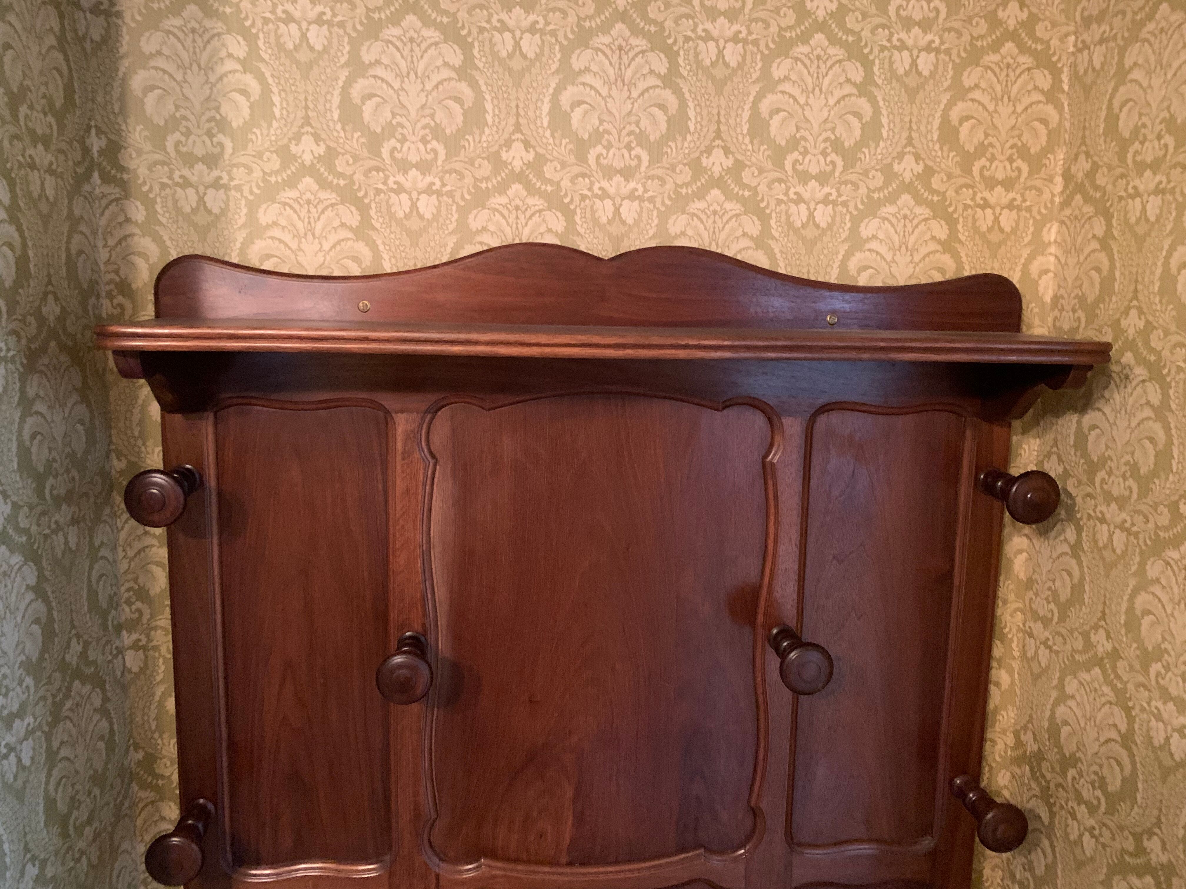 Cloakroom with walnut coat holder