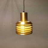 Hanging lamp in gold-colored aluminum with many layers of shades.