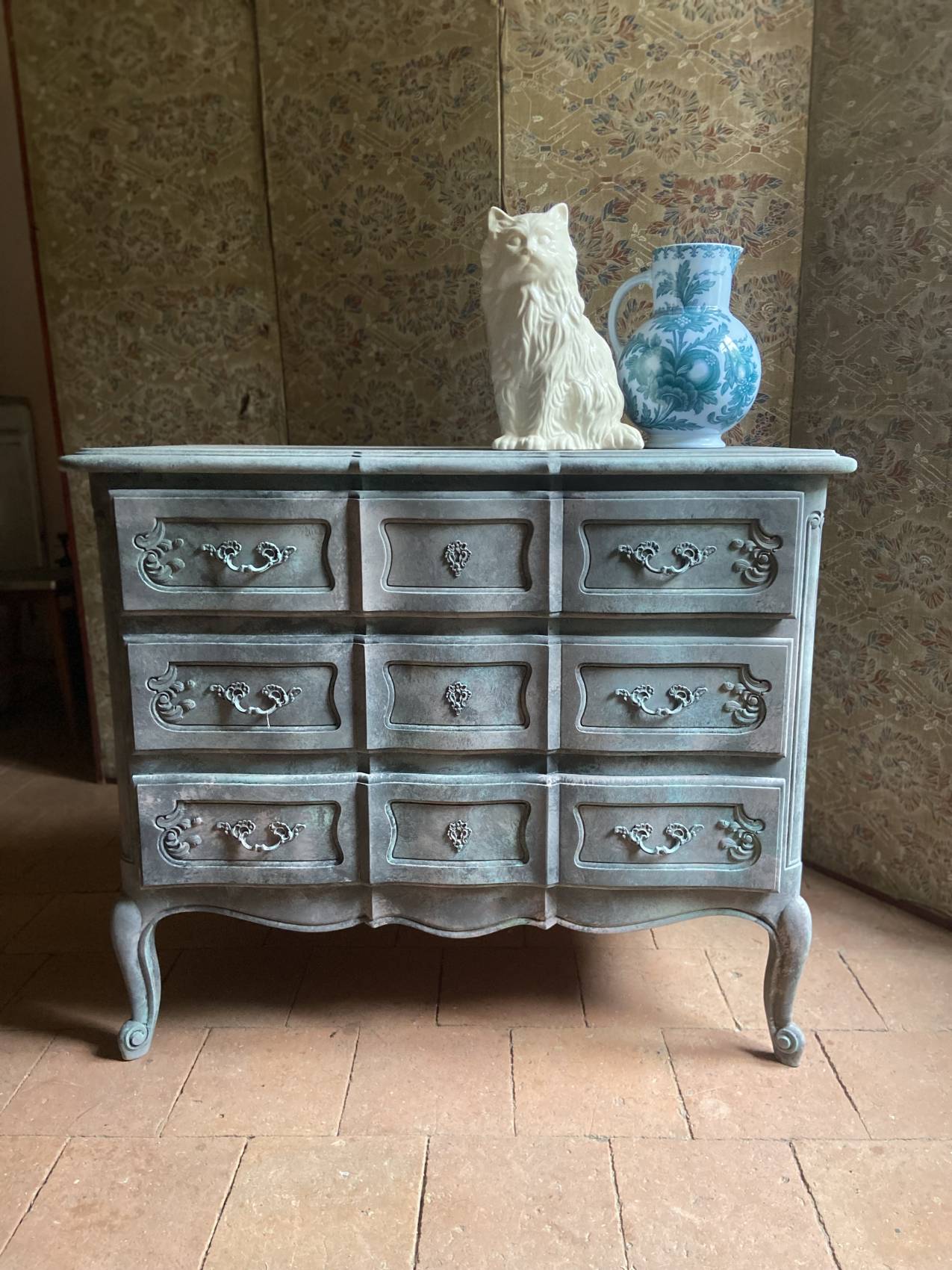 Antique Louis XV style commode, aged finish, practical elegance.