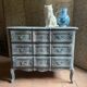 Antique Louis XV style commode, aged finish, practical elegance.