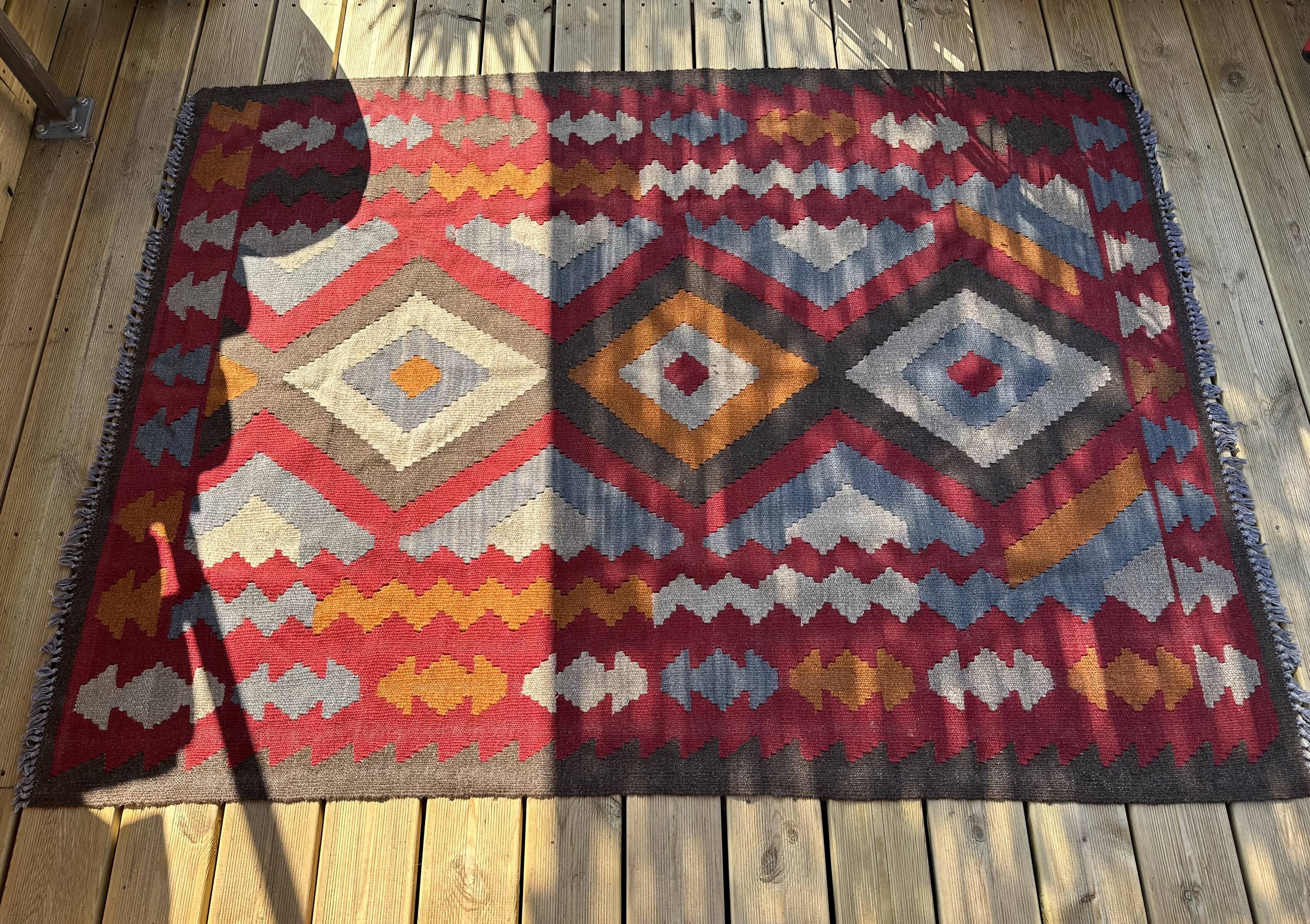 Multicoloured handmade wool kilim rug. Turkey, 1970s.
