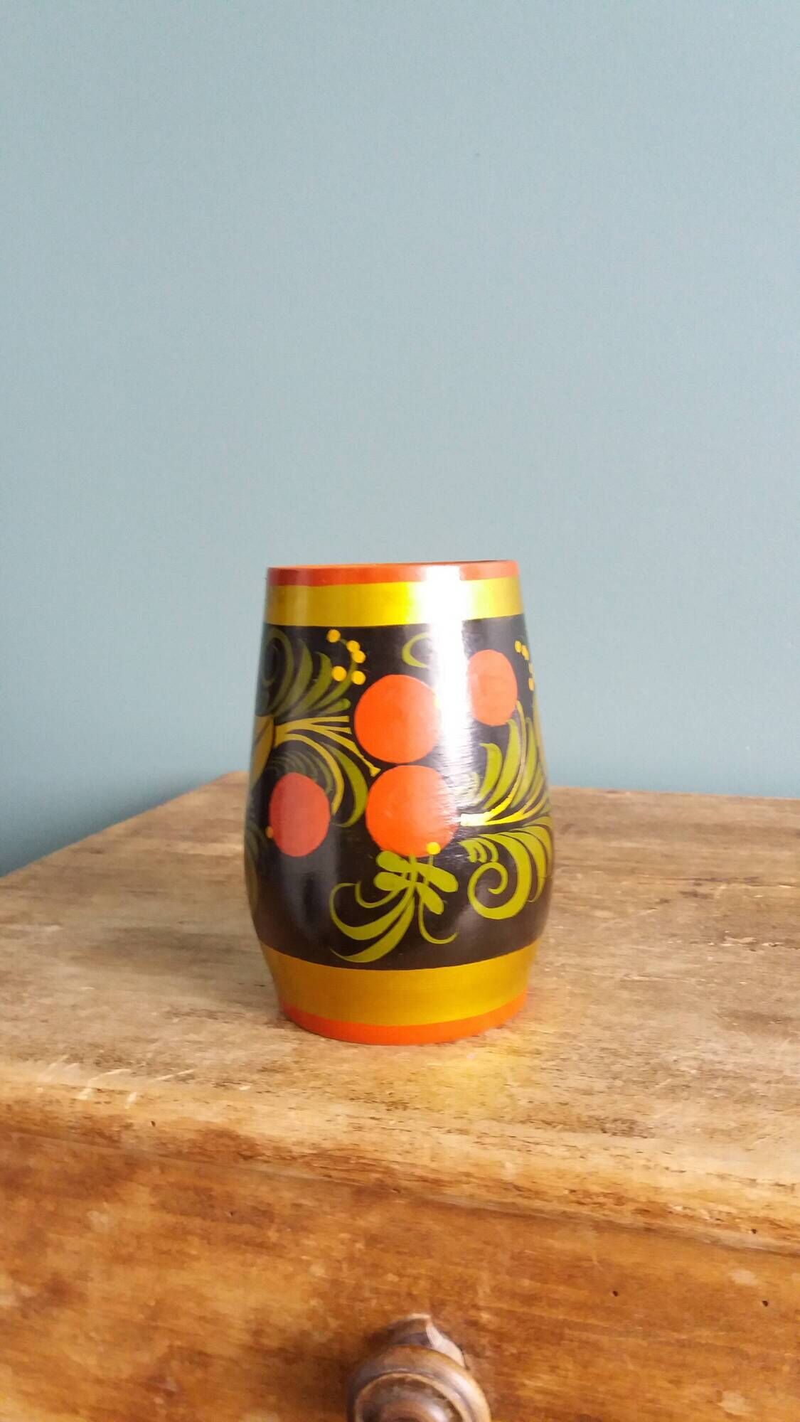 Khokhloma vase, Russian lacquered wood craftsmanship, hand-painted decoration.