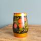 Khokhloma vase, Russian lacquered wood craftsmanship, hand-painted decoration.