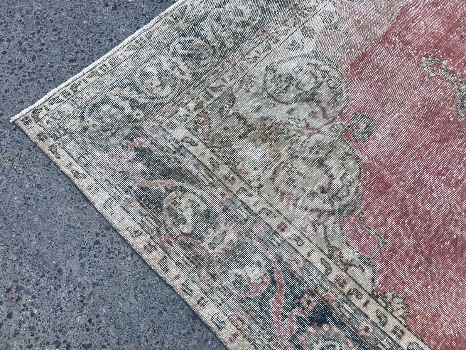 Pale pink rug with medallion