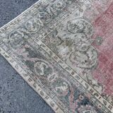 Pale pink rug with medallion