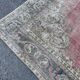 Tapis rose pâle avec médaillon