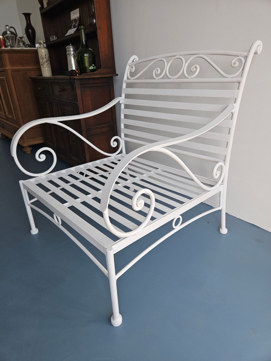 Robust wrought iron armchair