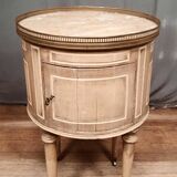 Round bedside table painted in trompe l'oeil