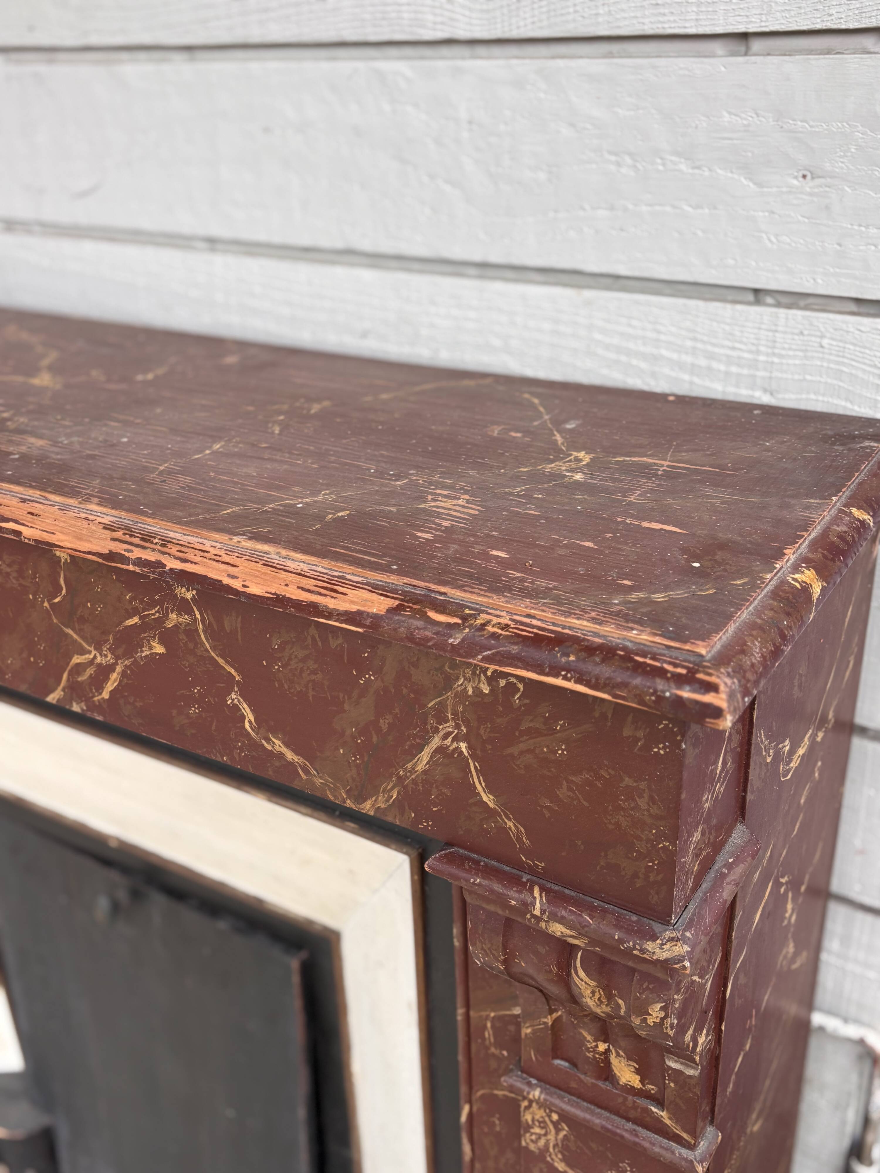 Wooden fireplace mantel imitating marble