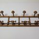 Wall-mounted coat rack made of turned wood