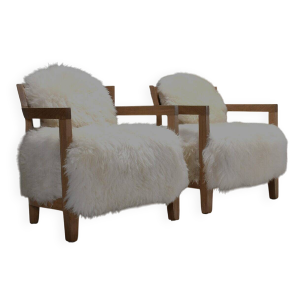 Ensemble de deux fauteuils en chêne massif et peau de mouton blanc cassé, Suisse, années 1970