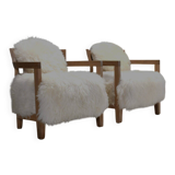 Set of two solid oak and off-white sheepskin chairs, Switzerland, 1970s
