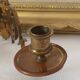 Pair of antique wall-mounted brass candle holders