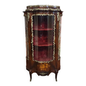 Curved display cabinet in Louis XV style with precious wood marquetry and gilded bronze.