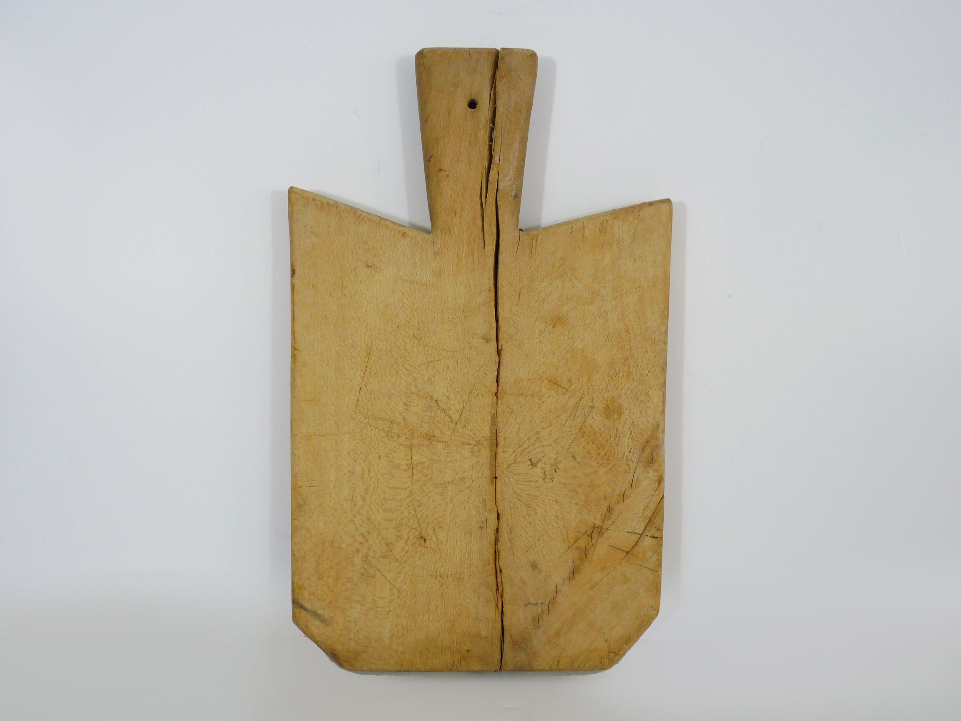 Small and old wooden cutting board. Year 50